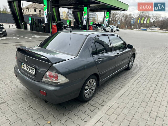 Сірий Міцубісі Lancer, об'ємом двигуна 1.6 л та пробігом 115 тис. км за 2800 $, фото 4 на Automoto.ua