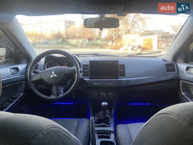 Серый Мицубиси Лансер, объемом двигателя 1.5 л и пробегом 224 тыс. км за 6300 $, фото 8 на Automoto.ua