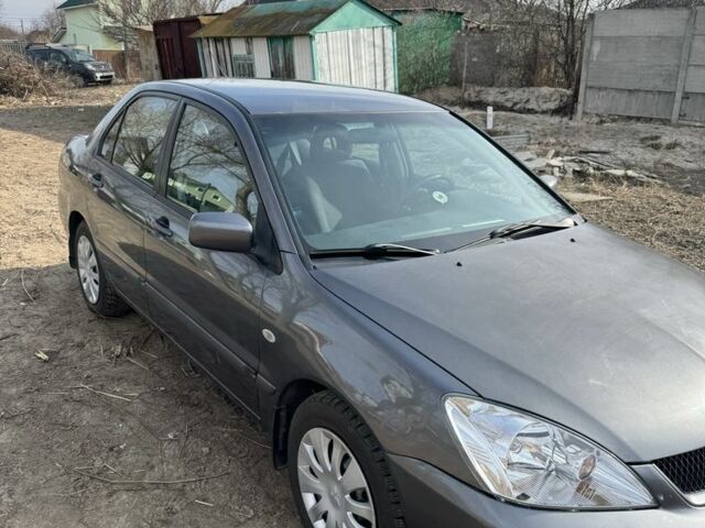 Серый Мицубиси Лансер, объемом двигателя 1.6 л и пробегом 129 тыс. км за 5000 $, фото 7 на Automoto.ua
