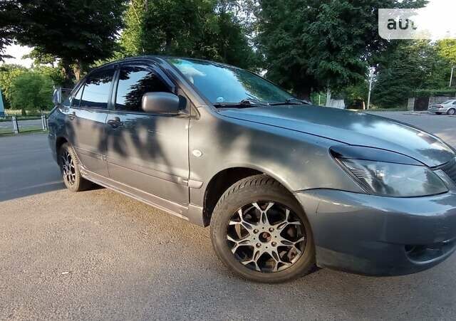 Сірий Міцубісі Lancer, об'ємом двигуна 1.6 л та пробігом 230 тис. км за 3950 $, фото 12 на Automoto.ua