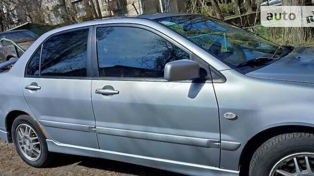 Серый Мицубиси Лансер, объемом двигателя 2 л и пробегом 297 тыс. км за 4600 $, фото 1 на Automoto.ua