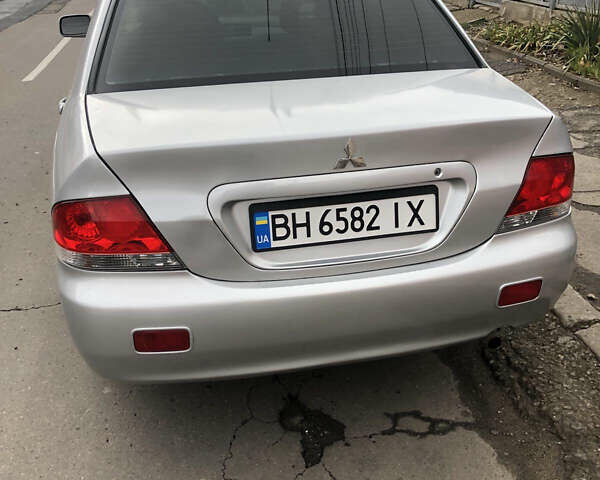 Серый Мицубиси Лансер, объемом двигателя 1.6 л и пробегом 450 тыс. км за 4500 $, фото 4 на Automoto.ua