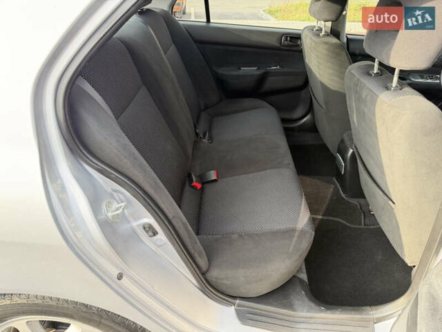 Серый Мицубиси Лансер, объемом двигателя 1.3 л и пробегом 160 тыс. км за 5555 $, фото 68 на Automoto.ua