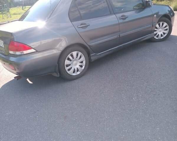 Серый Мицубиси Лансер, объемом двигателя 1.58 л и пробегом 300 тыс. км за 4400 $, фото 3 на Automoto.ua