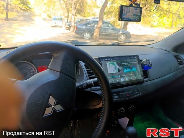 Серый Мицубиси Лансер, объемом двигателя 1.5 л и пробегом 220 тыс. км за 5200 $, фото 3 на Automoto.ua