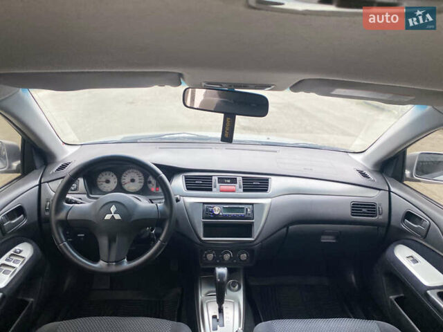 Серый Мицубиси Лансер, объемом двигателя 1.58 л и пробегом 240 тыс. км за 5500 $, фото 7 на Automoto.ua