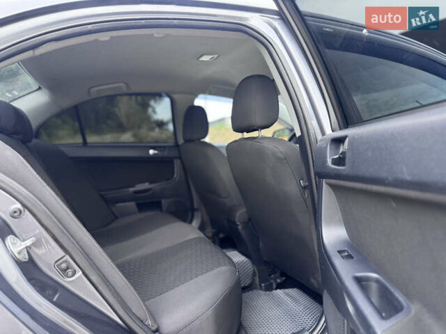 Сірий Міцубісі Lancer, об'ємом двигуна 2 л та пробігом 222 тис. км за 6300 $, фото 22 на Automoto.ua