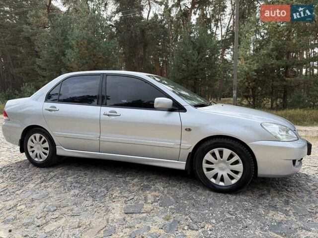 Серый Мицубиси Лансер, объемом двигателя 1.6 л и пробегом 200 тыс. км за 4400 $, фото 5 на Automoto.ua