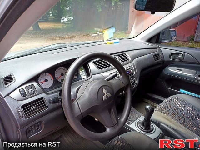 Серый Мицубиси Лансер, объемом двигателя 1.6 л и пробегом 160 тыс. км за 3800 $, фото 1 на Automoto.ua