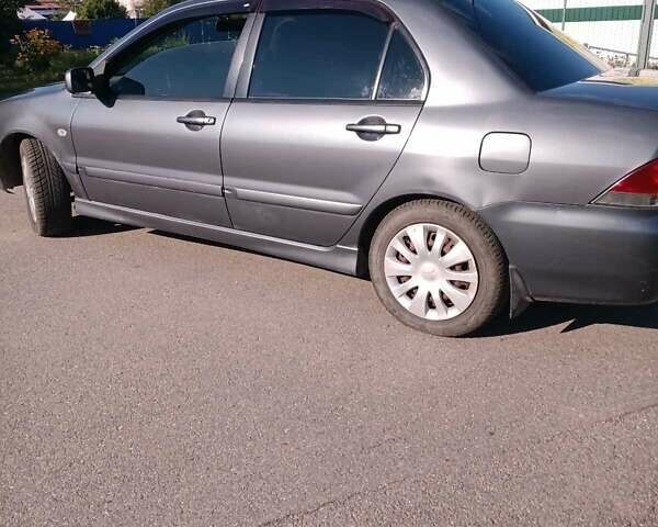 Серый Мицубиси Лансер, объемом двигателя 1.58 л и пробегом 300 тыс. км за 4400 $, фото 2 на Automoto.ua