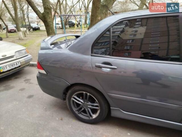 Сірий Міцубісі Lancer, об'ємом двигуна 1.58 л та пробігом 250 тис. км за 4750 $, фото 3 на Automoto.ua