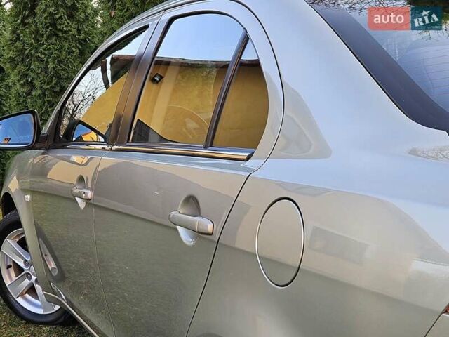 Серый Мицубиси Лансер, объемом двигателя 2 л и пробегом 282 тыс. км за 5450 $, фото 38 на Automoto.ua