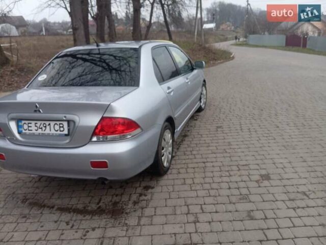 Серый Мицубиси Лансер, объемом двигателя 1.58 л и пробегом 175 тыс. км за 4000 $, фото 9 на Automoto.ua