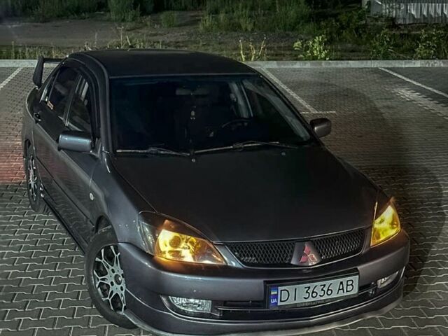 Серый Мицубиси Лансер, объемом двигателя 1.6 л и пробегом 280 тыс. км за 4000 $, фото 5 на Automoto.ua