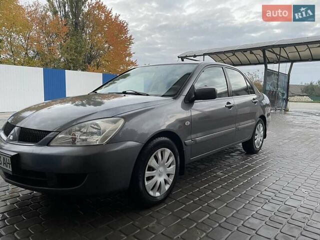 Сірий Міцубісі Lancer, об'ємом двигуна 1.6 л та пробігом 330 тис. км за 3500 $, фото 20 на Automoto.ua