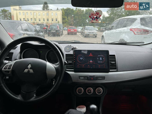 Серый Мицубиси Лансер, объемом двигателя 1.5 л и пробегом 210 тыс. км за 6600 $, фото 6 на Automoto.ua