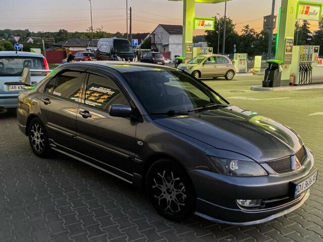 Серый Мицубиси Лансер, объемом двигателя 1.6 л и пробегом 280 тыс. км за 4000 $, фото 6 на Automoto.ua