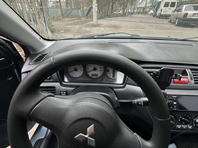 Серый Мицубиси Лансер, объемом двигателя 1.6 л и пробегом 238 тыс. км за 4300 $, фото 10 на Automoto.ua