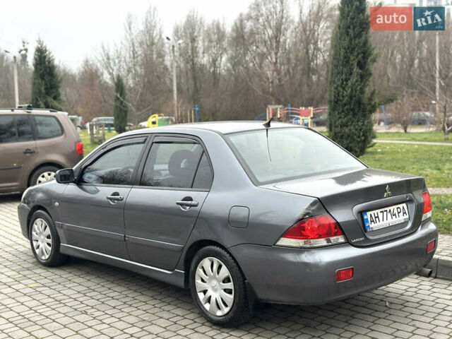 Сірий Міцубісі Lancer, об'ємом двигуна 1.6 л та пробігом 177 тис. км за 2800 $, фото 3 на Automoto.ua