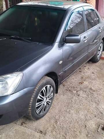 Серый Мицубиси Лансер, объемом двигателя 1.58 л и пробегом 400 тыс. км за 5000 $, фото 2 на Automoto.ua