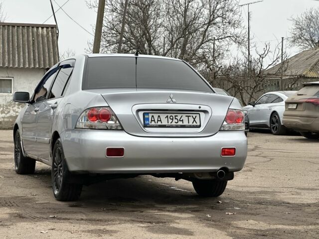 Серый Мицубиси Лансер, объемом двигателя 1.6 л и пробегом 298 тыс. км за 3600 $, фото 5 на Automoto.ua