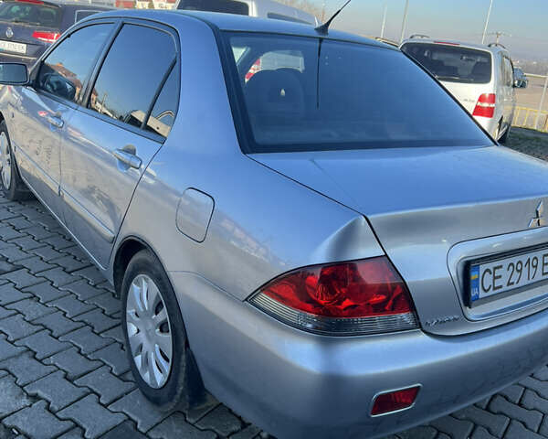 Серый Мицубиси Лансер, объемом двигателя 1.58 л и пробегом 178 тыс. км за 3300 $, фото 11 на Automoto.ua