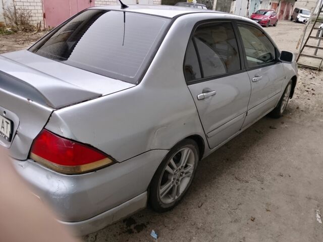 Серый Мицубиси Лансер, объемом двигателя 2 л и пробегом 495 тыс. км за 2800 $, фото 2 на Automoto.ua