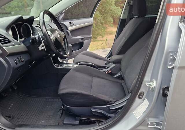 Серый Мицубиси Лансер, объемом двигателя 2 л и пробегом 213 тыс. км за 6550 $, фото 13 на Automoto.ua