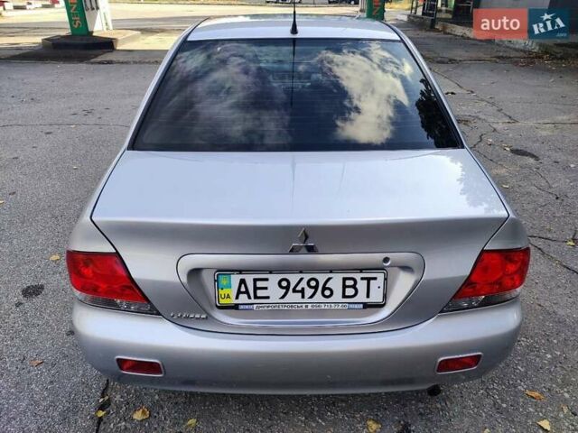 Сірий Міцубісі Lancer, об'ємом двигуна 1.58 л та пробігом 122 тис. км за 6300 $, фото 23 на Automoto.ua