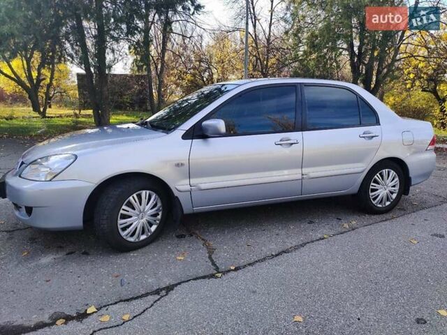 Сірий Міцубісі Lancer, об'ємом двигуна 1.58 л та пробігом 122 тис. км за 6300 $, фото 4 на Automoto.ua