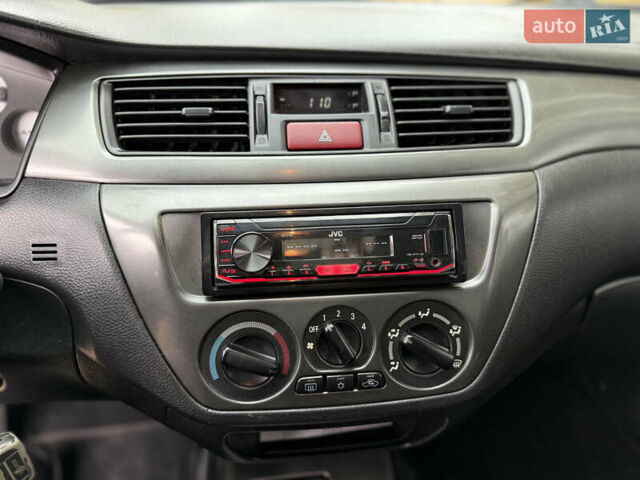 Сірий Міцубісі Lancer, об'ємом двигуна 1.58 л та пробігом 247 тис. км за 4900 $, фото 20 на Automoto.ua