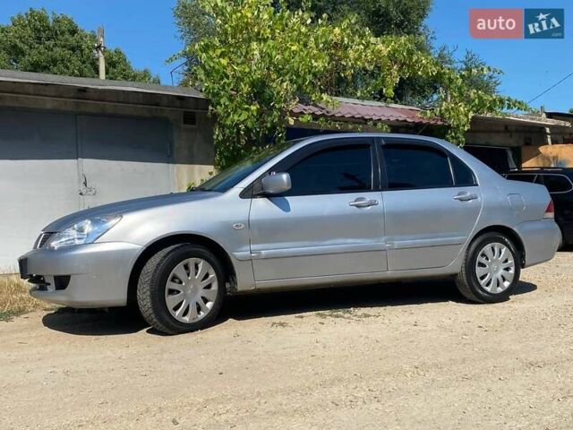 Сірий Міцубісі Lancer, об'ємом двигуна 1.6 л та пробігом 381 тис. км за 3350 $, фото 5 на Automoto.ua