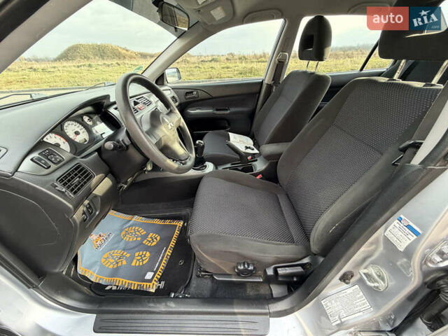 Сірий Міцубісі Lancer, об'ємом двигуна 1.3 л та пробігом 160 тис. км за 4999 $, фото 43 на Automoto.ua
