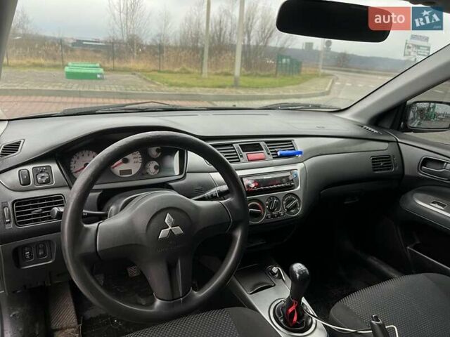 Сірий Міцубісі Lancer, об'ємом двигуна 1.6 л та пробігом 253 тис. км за 3100 $, фото 6 на Automoto.ua