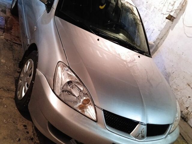 Сірий Міцубісі Lancer, об'ємом двигуна 1 л та пробігом 400 тис. км за 2850 $, фото 5 на Automoto.ua