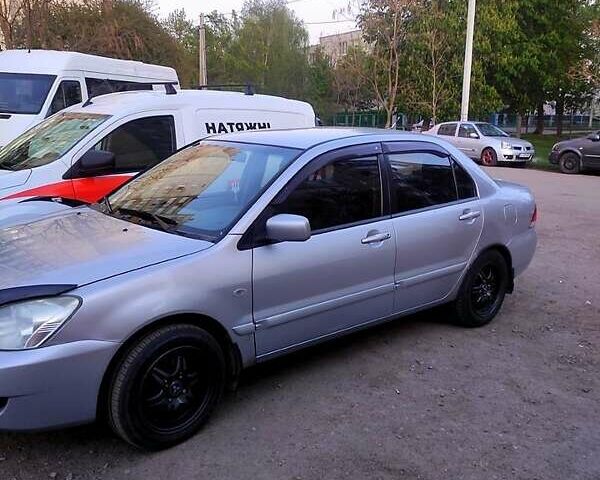 Серый Мицубиси Лансер, объемом двигателя 1.6 л и пробегом 302 тыс. км за 3200 $, фото 2 на Automoto.ua