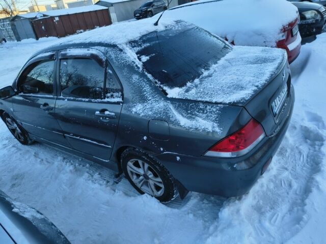 Серый Мицубиси Лансер, объемом двигателя 1.6 л и пробегом 230 тыс. км за 3201 $, фото 2 на Automoto.ua