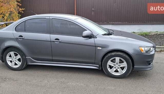 Серый Мицубиси Лансер, объемом двигателя 2 л и пробегом 189 тыс. км за 6800 $, фото 2 на Automoto.ua