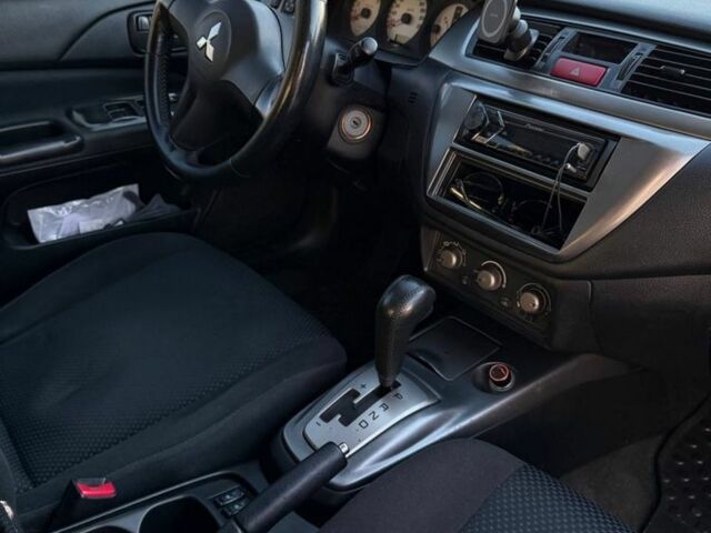Сірий Міцубісі Lancer, об'ємом двигуна 1.6 л та пробігом 174 тис. км за 4800 $, фото 6 на Automoto.ua