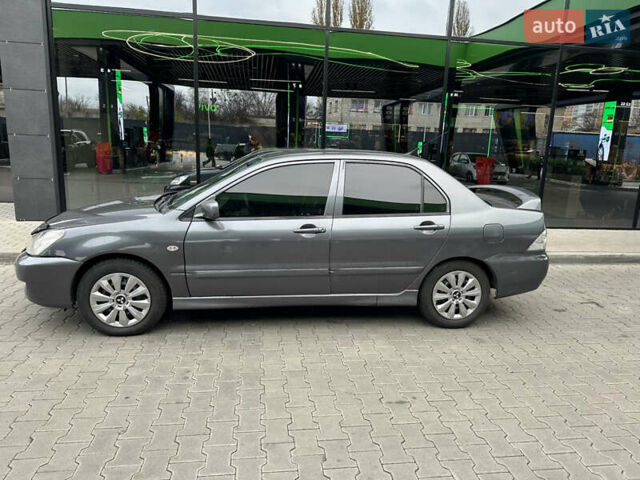 Сірий Міцубісі Lancer, об'ємом двигуна 1.6 л та пробігом 115 тис. км за 2800 $, фото 1 на Automoto.ua