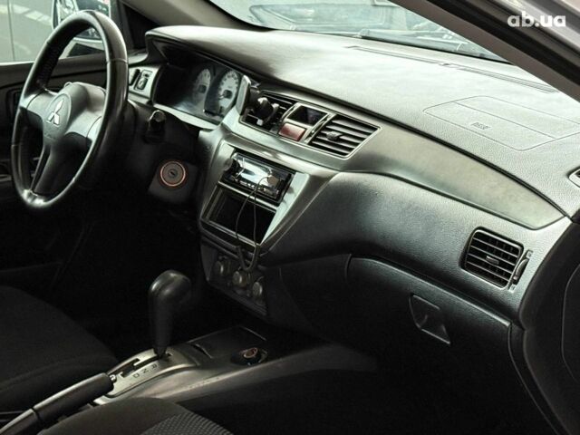 Серый Мицубиси Лансер, объемом двигателя 1.6 л и пробегом 174 тыс. км за 5990 $, фото 12 на Automoto.ua