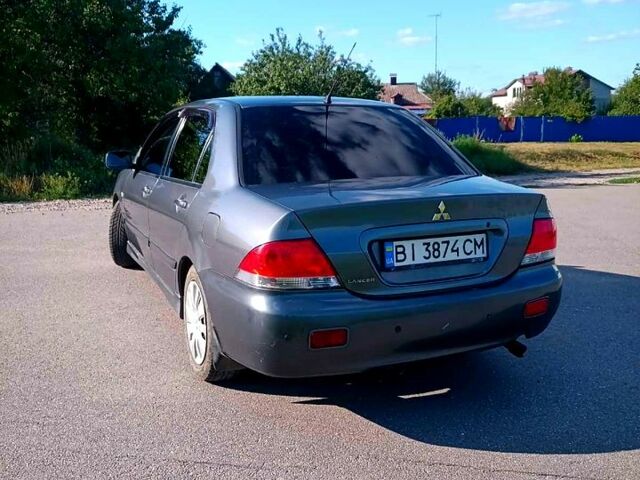 Сірий Міцубісі Lancer, об'ємом двигуна 1.6 л та пробігом 300 тис. км за 4400 $, фото 4 на Automoto.ua