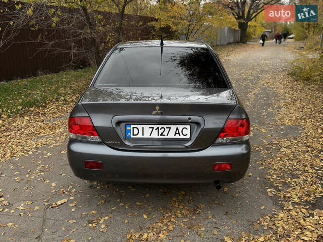 Сірий Міцубісі Lancer, об'ємом двигуна 1.58 л та пробігом 247 тис. км за 4900 $, фото 6 на Automoto.ua