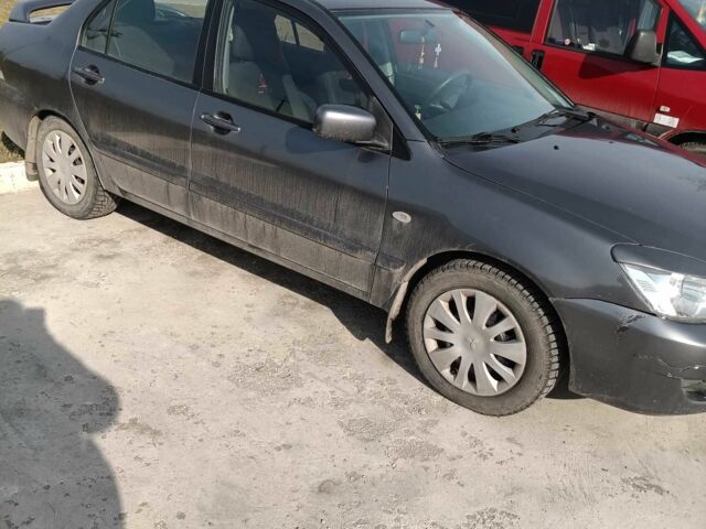 Сірий Міцубісі Lancer, об'ємом двигуна 1.6 л та пробігом 188 тис. км за 160000 $, фото 9 на Automoto.ua
