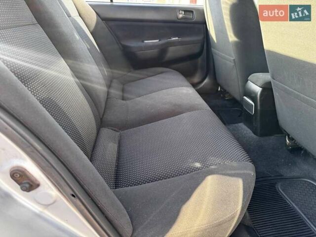 Сірий Міцубісі Lancer, об'ємом двигуна 1.6 л та пробігом 237 тис. км за 4950 $, фото 7 на Automoto.ua