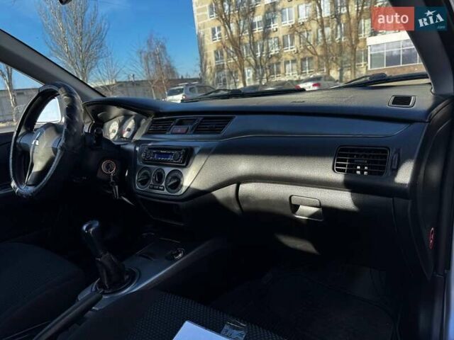 Сірий Міцубісі Lancer, об'ємом двигуна 1.6 л та пробігом 237 тис. км за 4950 $, фото 8 на Automoto.ua