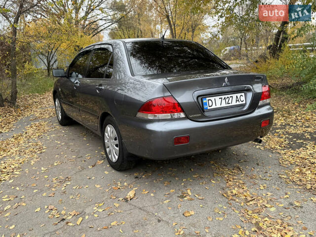 Сірий Міцубісі Lancer, об'ємом двигуна 1.58 л та пробігом 247 тис. км за 4900 $, фото 7 на Automoto.ua