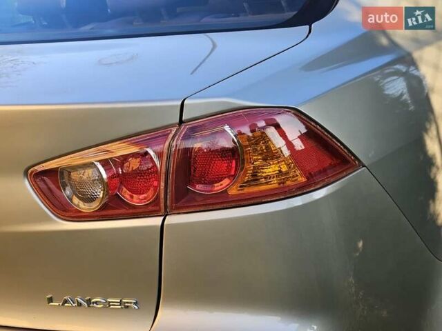 Серый Мицубиси Лансер, объемом двигателя 2 л и пробегом 282 тыс. км за 5450 $, фото 42 на Automoto.ua