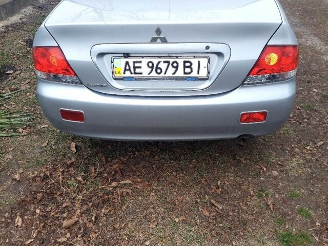 Серый Мицубиси Лансер, объемом двигателя 1.6 л и пробегом 220 тыс. км за 4000 $, фото 1 на Automoto.ua