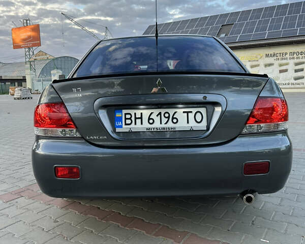 Сірий Міцубісі Lancer, об'ємом двигуна 1.6 л та пробігом 189 тис. км за 6200 $, фото 4 на Automoto.ua